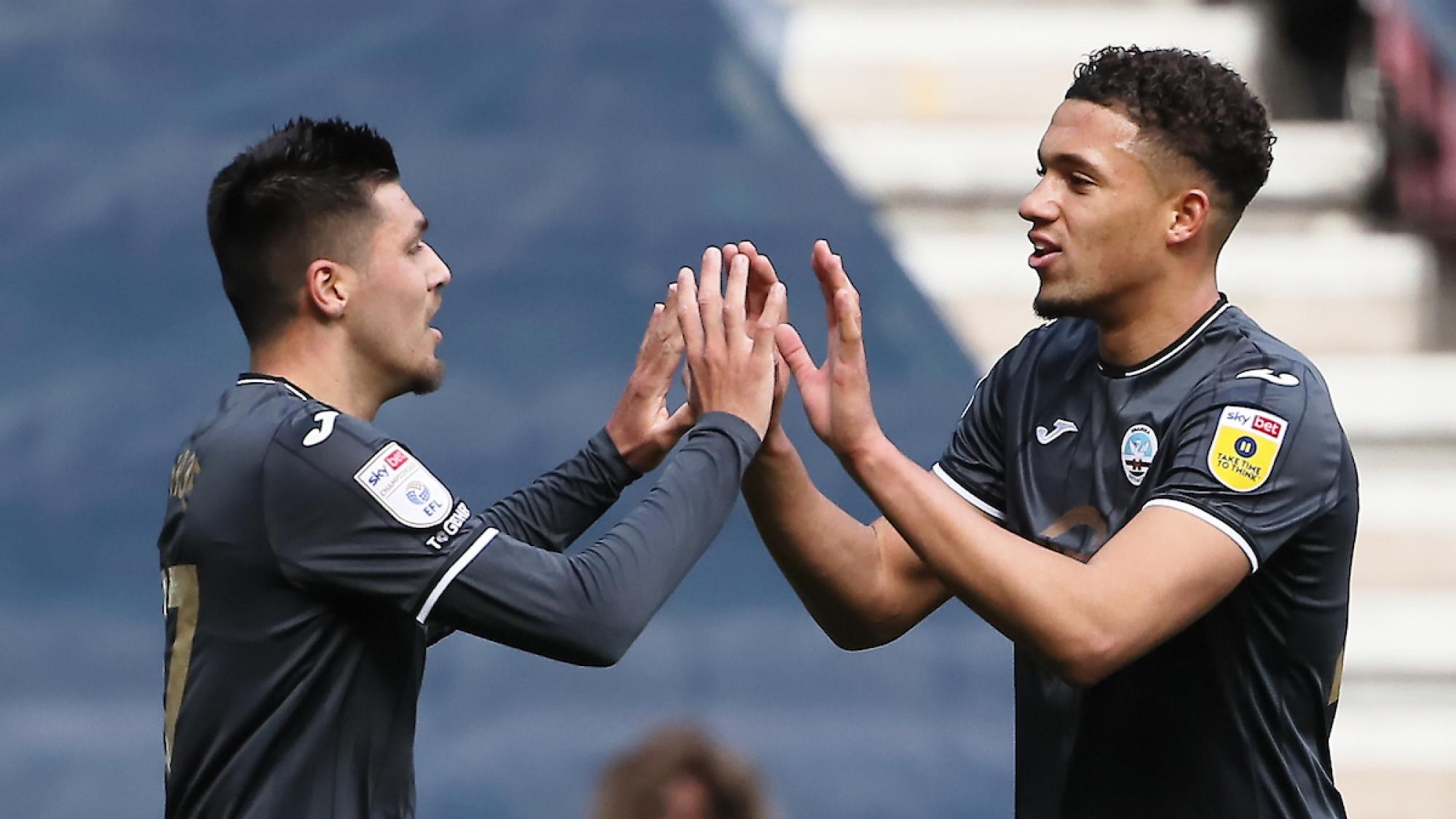 Joel Piroe and Nathan Wood at Wigan